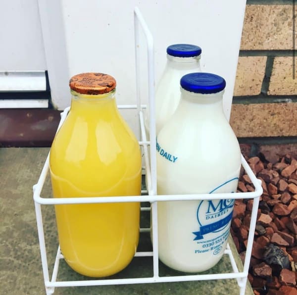 Glass Milk Bottles on doorstep
