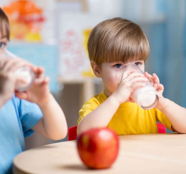 Children at school enjoying a glass of milk