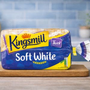 Kingsmill Soft White thick sliced bread on wooden board in kitchen setting