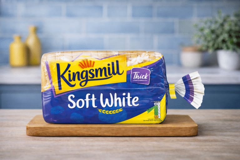 Kingsmill Soft White thick sliced bread on wooden board in kitchen setting